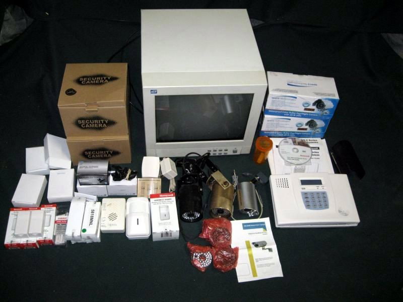 ADT MONITOR WITH SECURITY SYSTEM: ADT 14” Monitor & Security System Including: 9 Cameras & Additional Lens, 4 Switching Power Supplies, 9 Wireless Door/Window Transmitters & Parts & Honeywell LYNXR-2 Series Security System w/Manual.