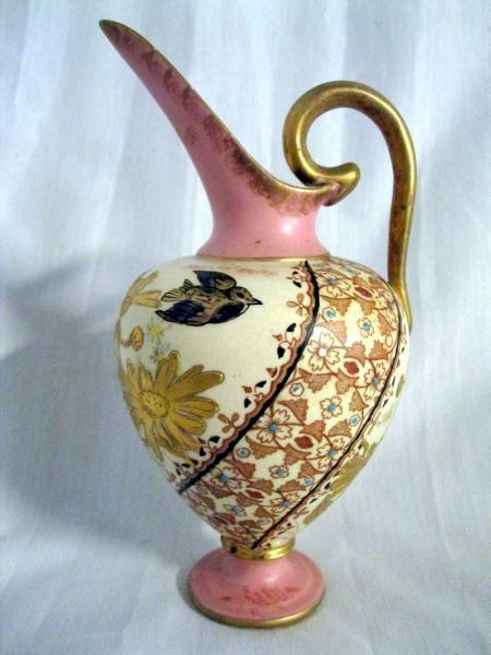 PORCELAIN PITCHER: Unique Footed Asian Style Pitcher, Goose Neck Handle, Elongated Slender Spout, Bulbous Body Painted w/Gold Flowers, Slanted Floral Design Over Antique White, Pale Pink Spout & Foot, “M” Mark, 7”