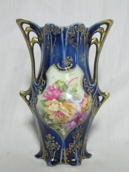 ROYAL VIENNA VASE: Exquisite Blue Porcelain Vase, Draped Gilt Handles & Delicate Flowers, Rose Bouquet Front, Scalloped Rim, 6 Point Base, Red Mark Royal Vienna Germany, 7.5”T.