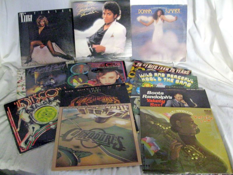 12 RECORD ALBUMS INC. JACKSON'S TRILLER: Records Mostly Sheathed and Showing Not Much Wear. Includes 1982 Epic Michael Jackson Thriller, 1983 Capitol Tina, 1976 Oasis Casablanca Donna Summer A Love Trilogy, 1971 2-Record Set CXS-9033 Boots R