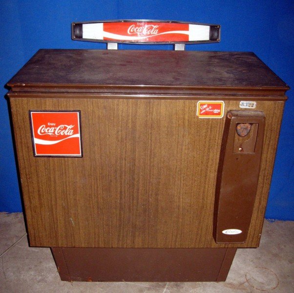 COCA COLA BOX COOLER: Coke Box Cooler, Manufactured by Cornelius, Has Key & Bottle Opener Mounted to Front, Model Cornelius 8322, 31”W x 24”D x 32”T.
