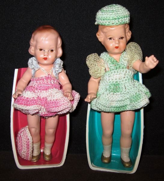2 German Paper Mache Dolls: 1950s girls in crochet dresses. Measurements: 6.5". Condition: Very Good stored in display cases and from a no-smoking environment.