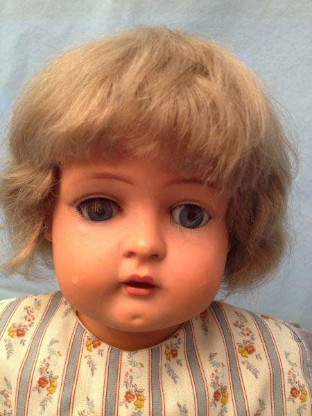 German Celluloid Schultz Doll: German Celluloid Schultz Doll German Celluloid Schultz Doll Includes: kid body wood arms sleep eyes and missing one eye lash.Measurements: 22" hCondition: Very Good stored in display cases and from a