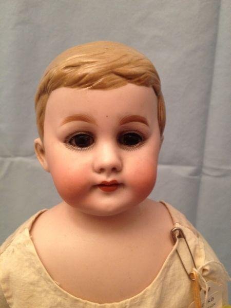 German Bisque Head "American School Boy" Doll: German Bisque Head "American School Boy" Doll 18" German Bisque Head "American School Boy" Doll A bisque shoulder head doll incised "30 B6 Germany" with molded hair set eyes closed mouth cloth body co