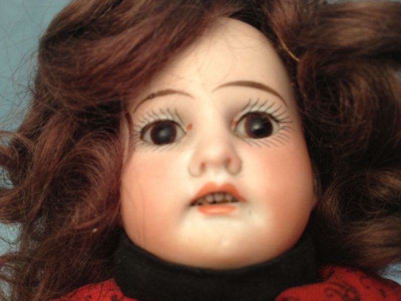 German Bisque Head Doll A&M 1894: German Bisque Head Doll A&M 1894 13" German Bisque Head Doll A&M 1894 A bisque head doll incised "A.M 8/Ox Dep 1894" with original set eyes replaced wig & pate open mouth 4 teeth and cloth body.Measur