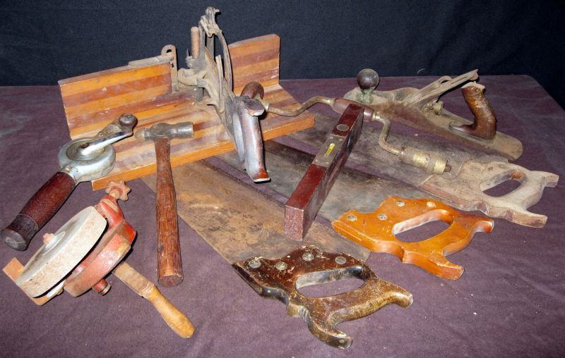 Vintage Tools Lot: Lot Includes 3 Saws, Wooden Perfection Miter Box & Saw, Hammer, Stanley Level No. 104, Hand Grinder, 2 Braces and Bailey #5 Plane.
