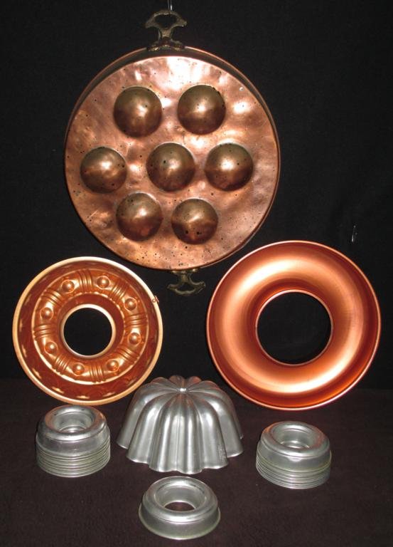 Copper And Aluminum Molds: 15 Round 3.75" Molds, One 3.5 Cup Copper Mold With Design, Plain Round Copper 10" Mold, 12" Copper Clad Mold With Handles and One 6.75" Aluminum Mold (Marked Mirror Aluminum).