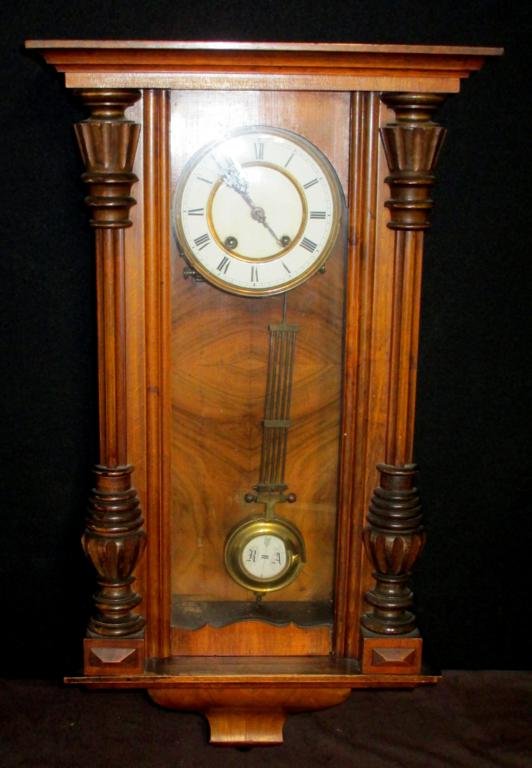 Pendulum Wall Clock: Wall Clock Pendulum Driven Wind Up Clock. Pendulum Marked RA. Pendulum And Face Are Porcelain. Measures 27.5" x 13.5". Normal Wear.