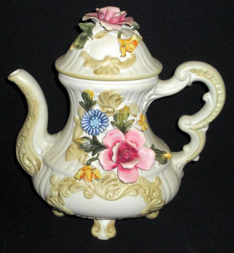Capodimonte Style Tea Pot with Lid: Capodimonte Style Tea Pot with Lid is marked "Made in Italy" on bottom, approx. 11.75 X 10.75. One leaf has been reapplied.