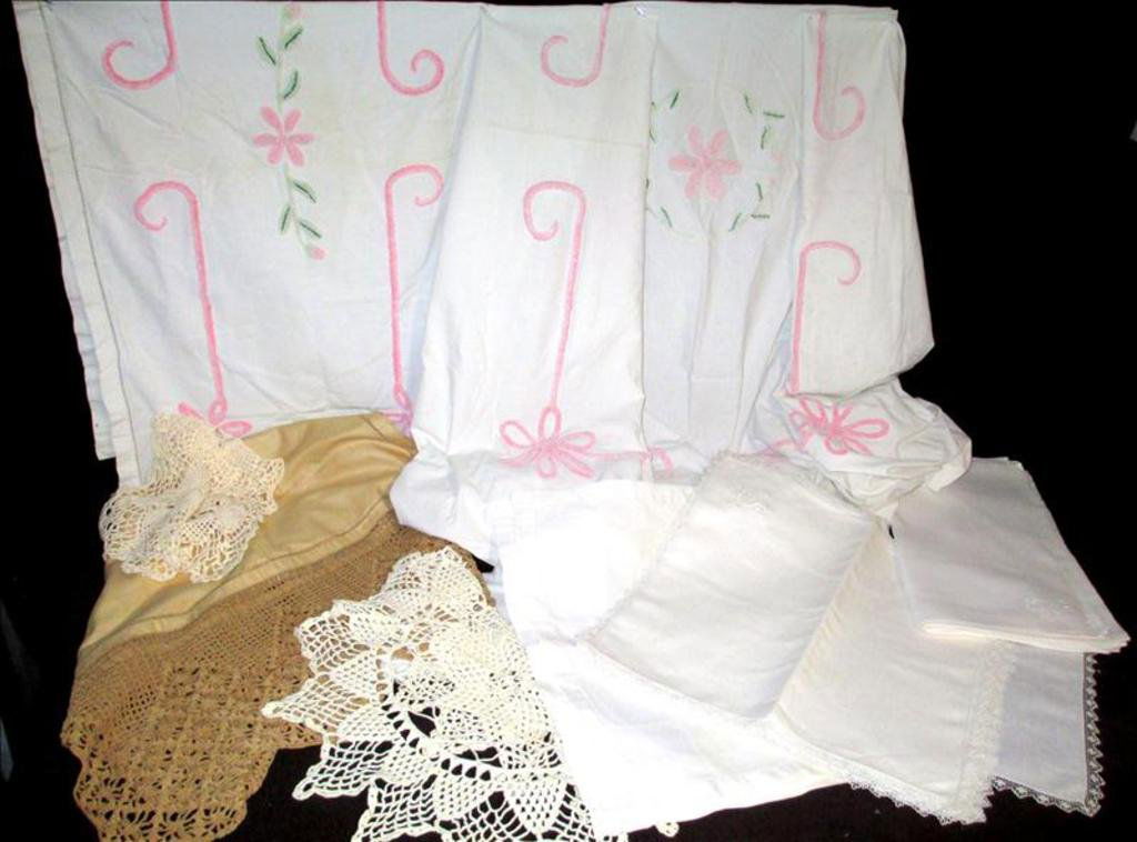 Linen Lot: Linen Lot including 8 tea towels 11" x 17"; 1 crocheted doily 7" x 23"; 1 crocheted doily 19" diameter; 12 hand thrown lace embroidered napkins 16.5" square; 4 placemats 17.75" x 11.5"; 12 embroidered