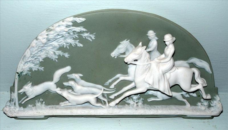 JASPERWARE HUNT PLAQUE: Jasperware Hunt Plaque, Half-Moon Shape In Green w/White High-Relief Figures, Marked 11816 Germany, Pierced For Hanging, 4.25"T x 8.75"W.