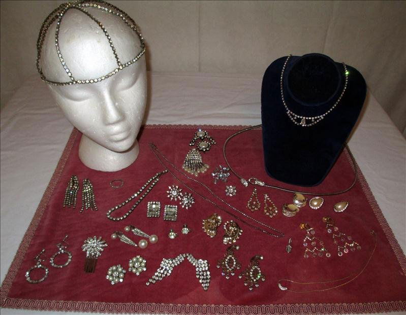 RHINESTONE COSTUME JEWELRY: Rhinestone Costume Jewelry, Includes A Trifari Pendant, A Headpiece, Hair Clip, Ring, Bracelet, 4 Necklaces And 14 Pair Of Earrings