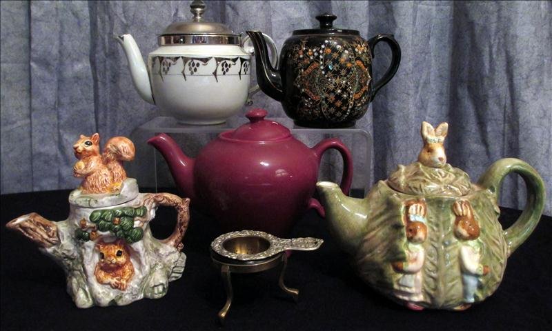 FIVE TEA POTS: Five Tea Pots, Including Unmarked 6.25"T Cabbage w/Bunnies, 6"T Ohio Hand Paianted Pot w/Attached Lid, 5.25"T Made In England Enameled Pot, 6.25"T Mccormick Tea Baltimore Md Pot, And 5.25"T Squirrel I