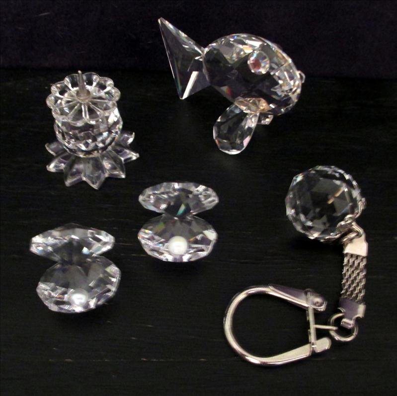 SWAROVSKI AND MORE LOT: Swarovski and More Lot, Including Ball Key Chain (Unmarked), Number 131 Candleholder Marked SC (1 5/16"T), Two Oyster w/Pearl (0.75") Unmarked, and Fish (2") Unmarked.