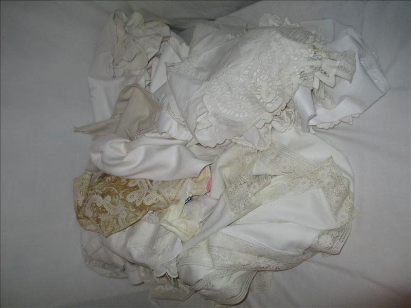 LINEN LOT: LINEN LOT Includes many table runners, napkins, doilies, handkerchiefs, 3 tablecloths w/stains as shown (128" x 66", 86" x 70", 48" x 64")