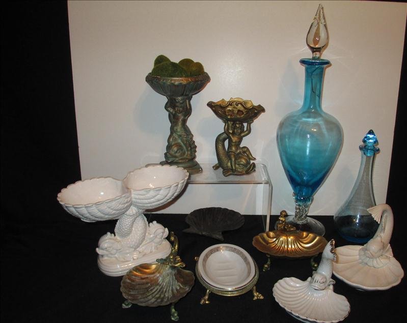 DOLPHIN PEDESTAL SOAP DISHES & MORE BATHROOM DECOR LOT: DOLPHIN PEDESTAL SOAP DISHES & MORE BATHROOM DECOR LOT Includes 9 soap dished (3 w/dolphin pedestal feet and 2 w/boy on dolphin), 2 glass decanters (10" and 20").