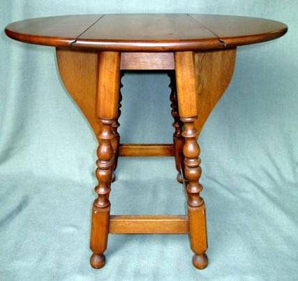 Drop Leaf Butterfly Wing Table: Drop Leaf Butterfly Wing Table, Cherry, Spindle Legs, Open 21.5" T x 25.5" W x 20" D, Closed 20.5" W x 11.25" D x 21.5" T.