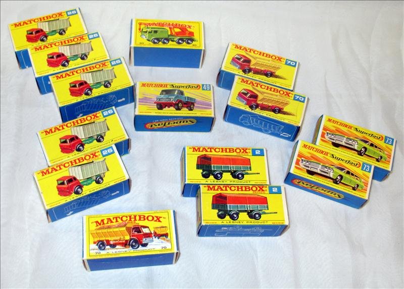 Lesney Matchbox Series Lot: Lesney Matchbox Series Set w/Original Boxes, Inc. 2 #2 Mercedes Trailers, 5 #26 GMC Tipper Trucks, #38-Wheel, #49 Unimog, 3 #70 Grit-Spreading Trucks (One in Larger Box than Others), 2 #73 Mercury Com