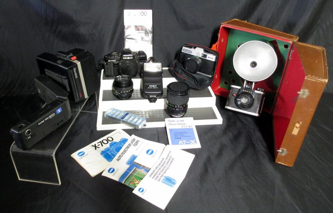 Camera Lot: Camera Lot, Inc. Minolta X700, Minolta Auto 132 PX Flash, Minolta MD 50mm Lens, Tokina 28mm-85mm Lens, Telephoto Lens, Ansco Ready Flash in Camera Case, Kodak Tele-Ektra, Polaroid Sun 600, Minolta Cam