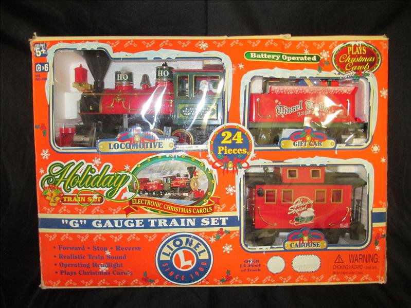 Holiday Train Set Plus: Holiday Train Set, Locomotive, Drift Car, Caboose, Lionel G-Gauge Train Set, in Original Box w/Track. Plays Christmas Carols.