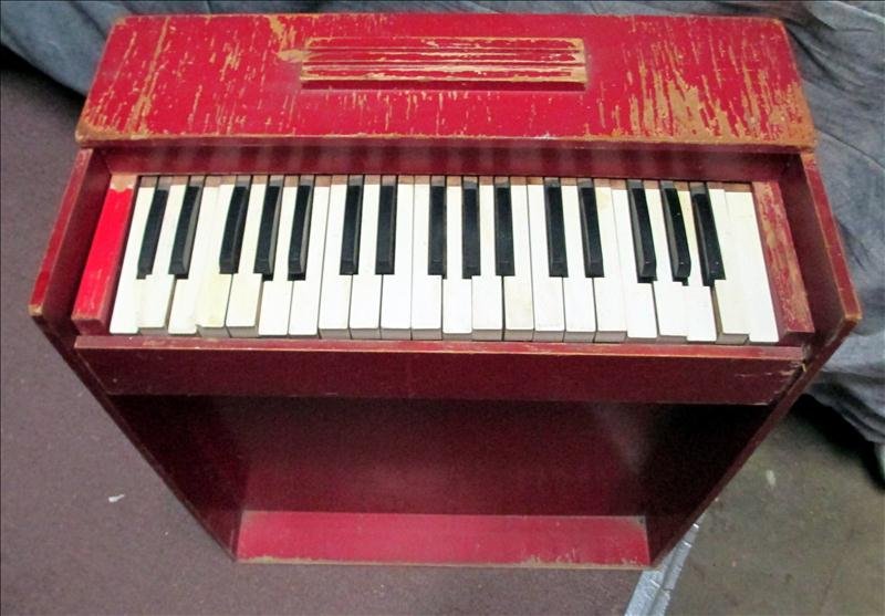 Electric Toy Piano: Electric Toy Piano, Painted Red, by Esto Organ Company.
