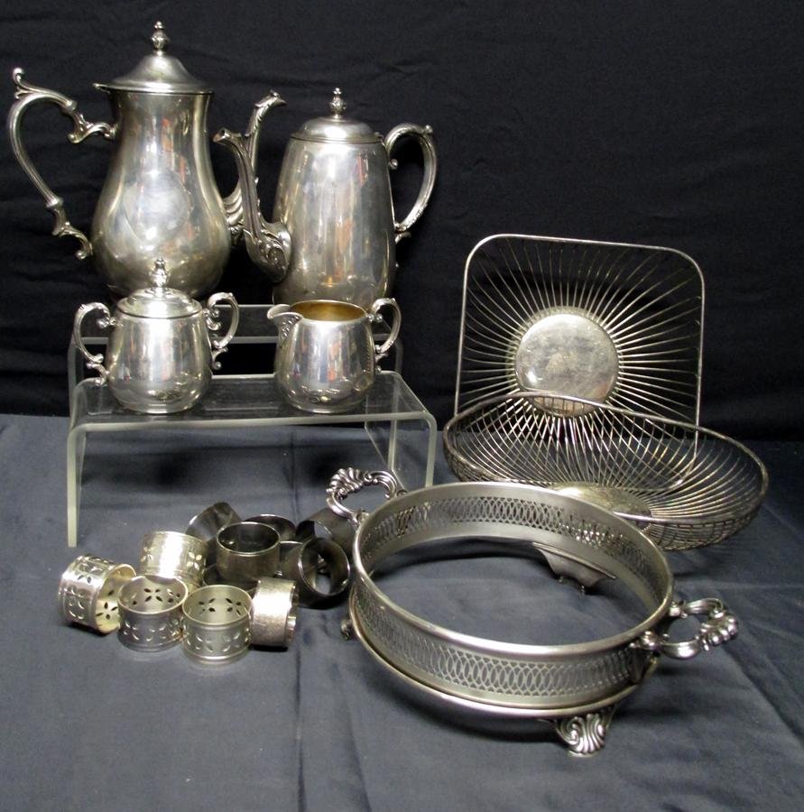 Silver Lot: Silverplate Lot w/Coffee Pot, Tea Pot, Creamer and Sugar, Napkin Rings, Baskets, Casserole Cover & Holder.