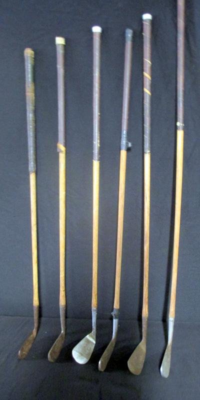 Wooden Golf Clubs: Clubs Include Grand Slam #2 Fairway Iron, Grand Slam #7 Pitching Iron, Bonnie B Putter, Invincible Putter and Spalding Bros. Dundee Irons.