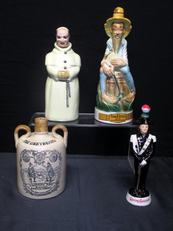 Ceramic Decanters & Jug: Monk (Marked Made in Italy), Hillbilly (Old Cabin Still Kentucky Bourbon Weller Distillery), a Gendarme, a Liquor Galliano and Graybeard Double-Handled Heather Dew Scotch Whiskey Jug.