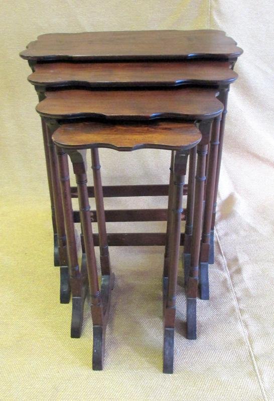 Quartet of Nesting Tables: Shaped Tops, Turned Slender Legs, Smallest 9.5 x 13 x 21"T, Largest 20.5 x 13 x 23"T.