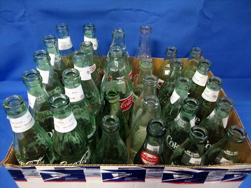 29 Vintage Soft Drink Bottles: 29 Vintage Soft Drink Bottles, Including Dr. Pepper, Grapico, Hydrox, 7-Up, and 25 Coke Bottles w/Some Noted From Georgia, Louisiana, Texas, Alabama, Tennessee, Virginia, Illinois, Florida and Marylan