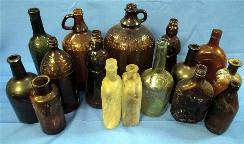 30 Collectible Bottles: 30 Collectible Bottles, Including Varying Size Embossed Clorox Bottles, Embossed "33" Bleach Bottle, Mrs. Butterworth and One Pint Embossed Flask.