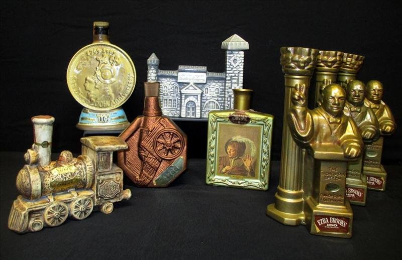 8 Empty Vintage Decanters: 8 Empty Vintage Decanters, Including Three 12" Ezra Brooks Winston Churchill (2 w/Boxes), 8.25" Old Taylor Distillery Co., 9" Bonded Beam, w/Cannon 8.5" Beam's Choice w/Picture Boy Holding Flute, 10.2