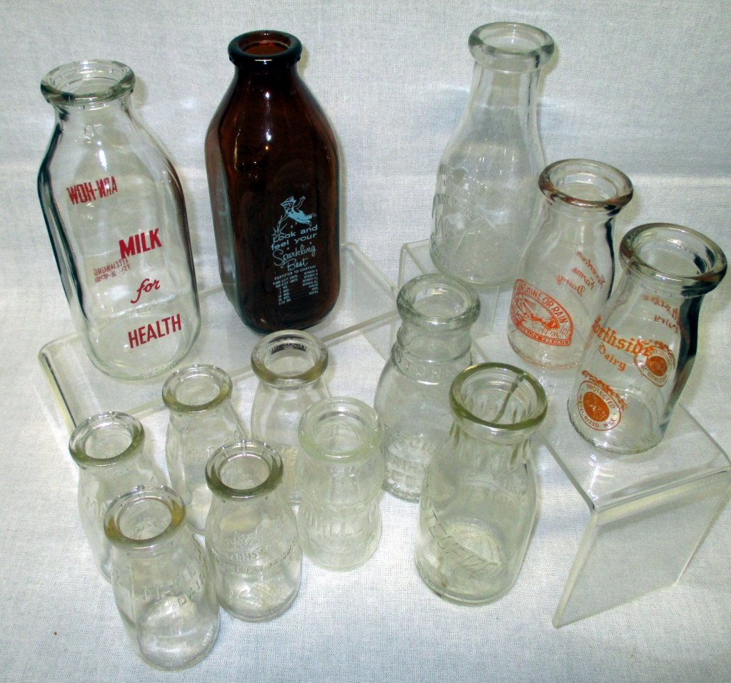13 Vintage Milk Bottles: Including Blue Boy Sparkle Milk; Arn-How Milk for Health; Howertown Farms Dairy; Northside Dairy; 3 Maple City Dairy; Lockshore Farms Kalamazoo, Michigan; Rosewood Dairy, Bireleys; Burschel Dairy; Uni