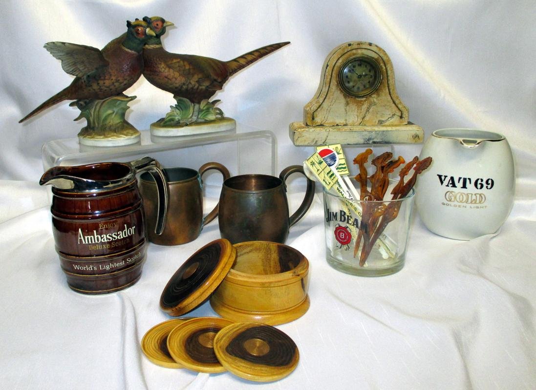 Men's Lot w/2 Lefton Pheasant Figures: Including 2 solid copper mugs by West Bend Aluminum Co.; desk clock, Ambassador scotch pitcher; Vat 69 scotch pitcher; bar picks w/5 Ubangi depicting the "Gravity of Life."