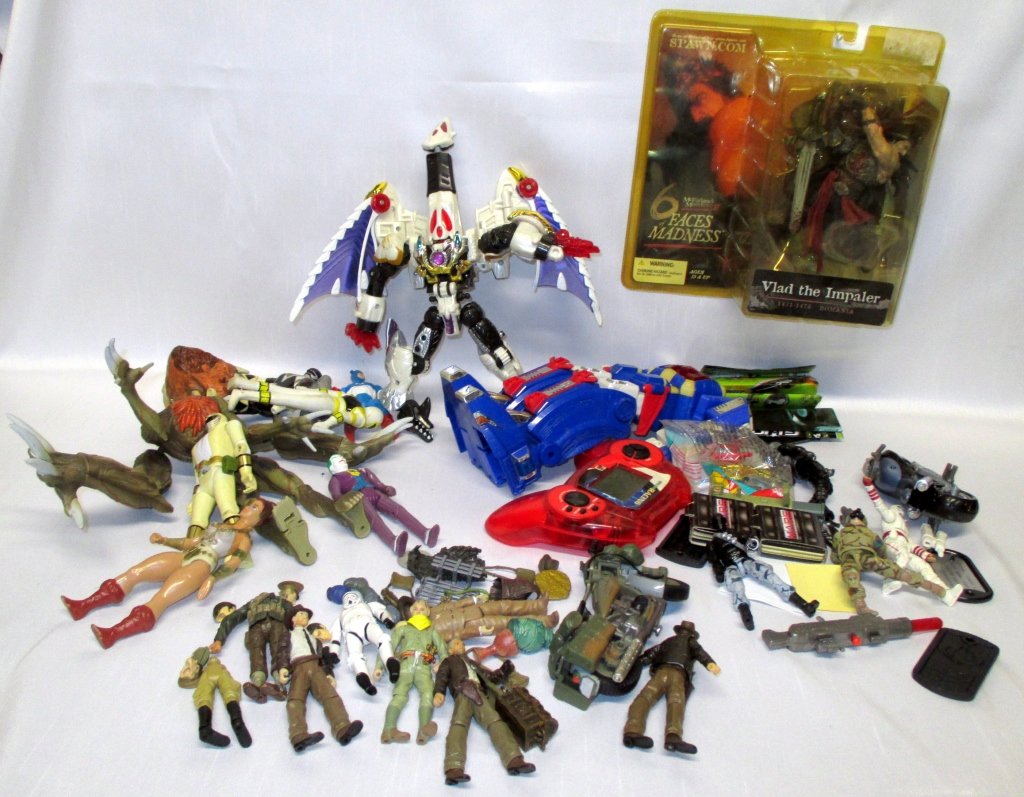 Collectible Toy Figure Lot: Including Vlad the Impaler (mint in package w/some discoloration), Indiana Jones, GI Joe, Transformers, Super Heroes.