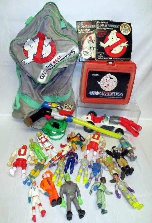 Ghostbusters Plus Lot: Including Ghostbuster backpack, booklets & lunch box together w/ray gun car and variety of action figures.