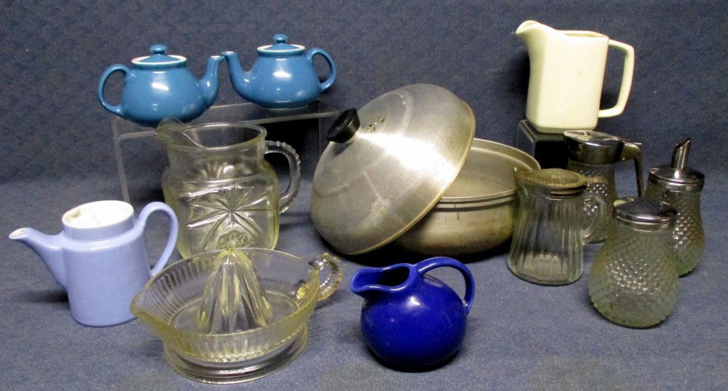Vintage Kitchenalia: Including 3 individual Hall covered teapots, reamer, Mirro aluminum bun warmer, pitchers & shakers.