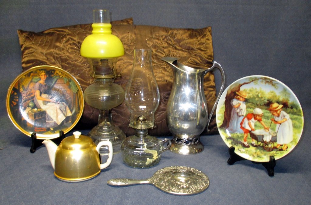 Ladies Lot w/Silver & Oil Lamps Plus: Including 11" tall Sheffield pierced ring base pitcher, crackled ceramic & gold metal individual tea cozy, Norman Rockwell & Jeanne Down collector plates, 2 oil lamps, 2 pillows.