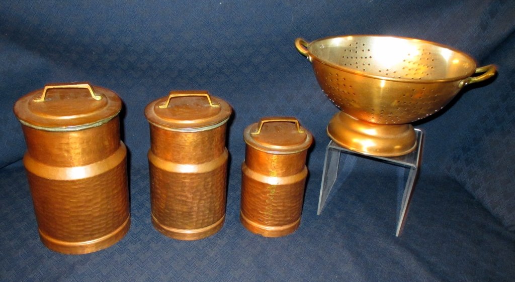 Vintage Copper Canisters & Colander: Including 3 covered hammered canisters (8.5", 8" & 6.5" tall) and colander w/handles (11" handle to handle).
