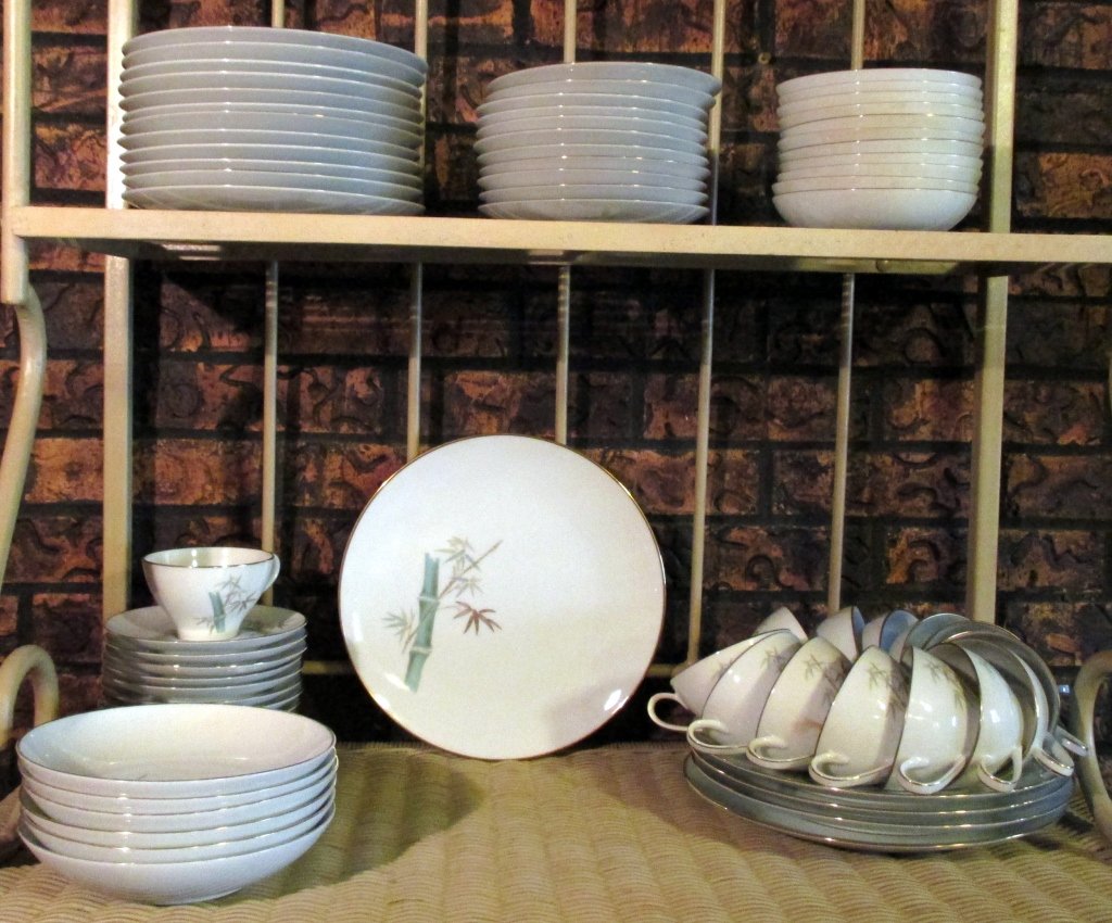 Noritake Oriental China Dinnerware: Pattern of bamboo stalks, 72 pieces including: 5 dinner plates, 12 salad plates, 11 bread & butter plates, 13 cups & saucers, 1 additional cup, 5 cereal bowls, 11 fruit bowls.