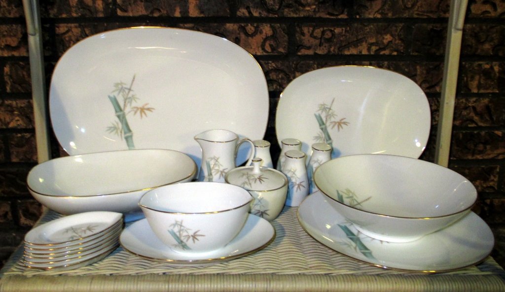 Noritake Oriental China Serving Pieces: Pattern of bamboo stalks, 19 pcs. including: creamer, covered sugar, gravy w/attached plate, 9" round serving bowl, 2 salt & pepper sets, 10.5" chop plate, 11.5" platter, 15" platter, 10" rectangular 