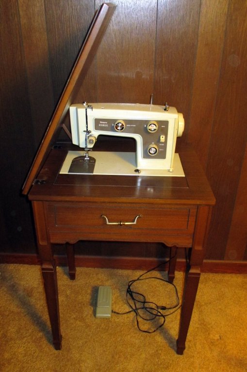 Kenmore Sewing Machine & Stand: Sears Model 148.13100 in Federal style stand together w/large box of notions. Machine works.