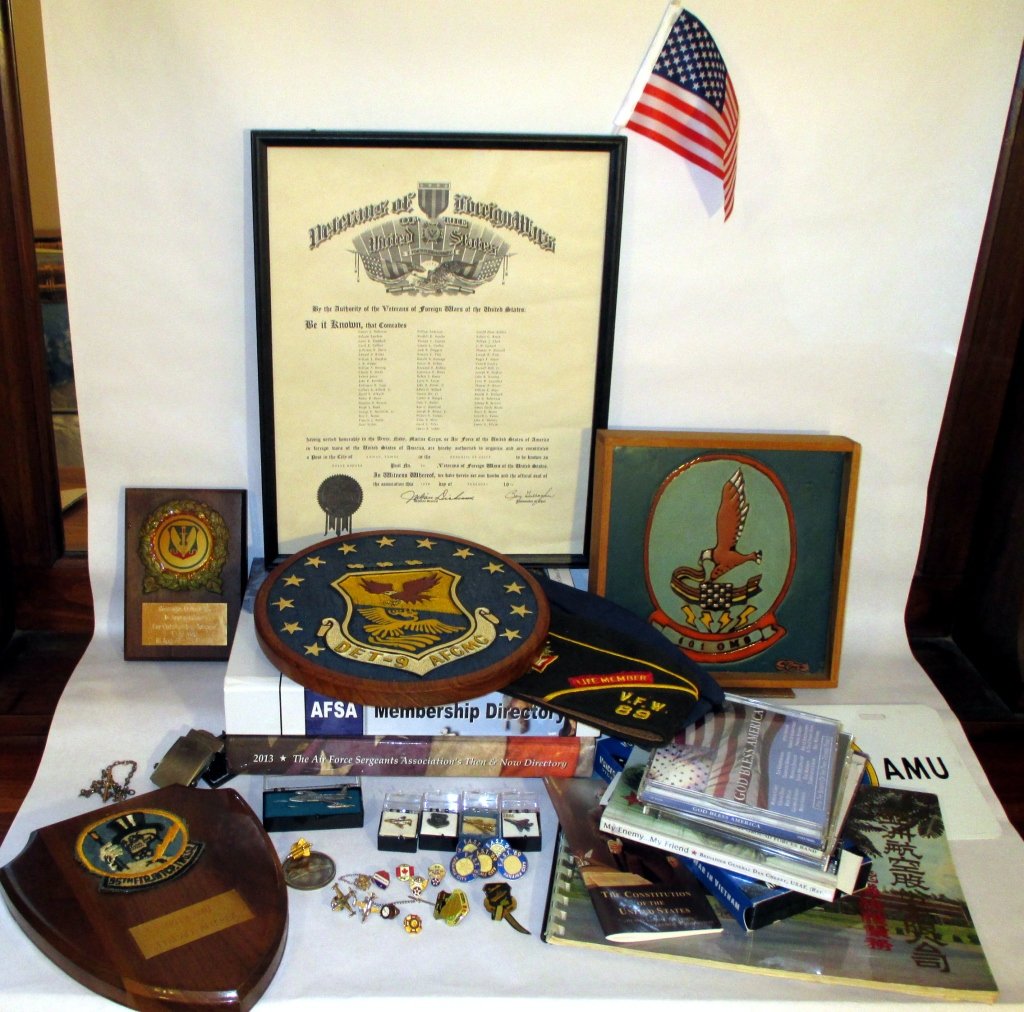 Veteran's Memorabilia Lot: Inc. plaques, pins, hats, framed Veterans of Foreign Wars of US Tainan, Taiwan Post 89 1970 w/hat, AF SGT Membership Directories 2011 & 2013, Bonehead plaque & license tag holder and more.
