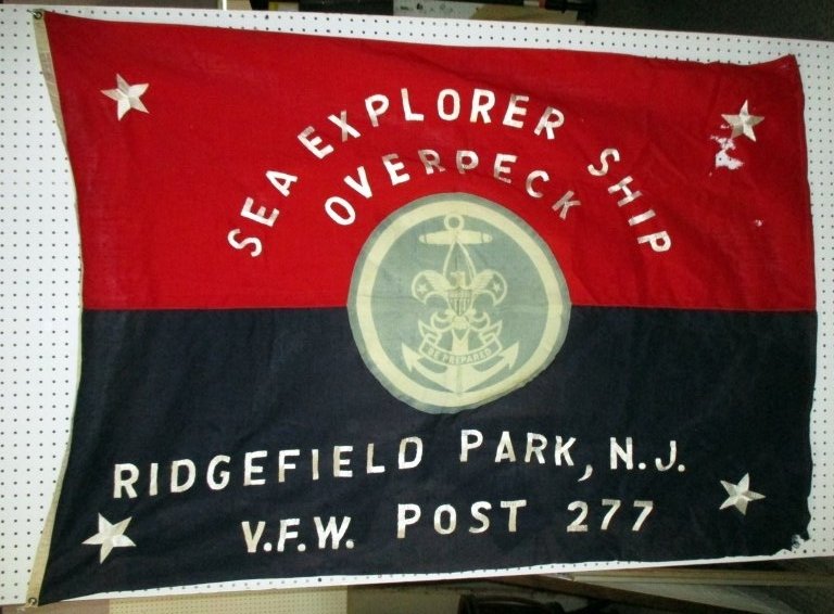 Sea Explorer VFW Flag: Sea Explorer Ship Overpeck, Ridgefield Park, N. J., V. F. W. Post 277, Annin wool, 50" x 67". Holes in red field, corner tatters.