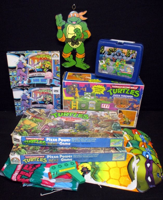 Teenage Mutant Ninja Turtles Games Plus: 2 Puzzles, 2 Pizza Power Games and Pizza Thrower Vehicle (all in original boxes), lunch box w/thermos, wall hanging and more.