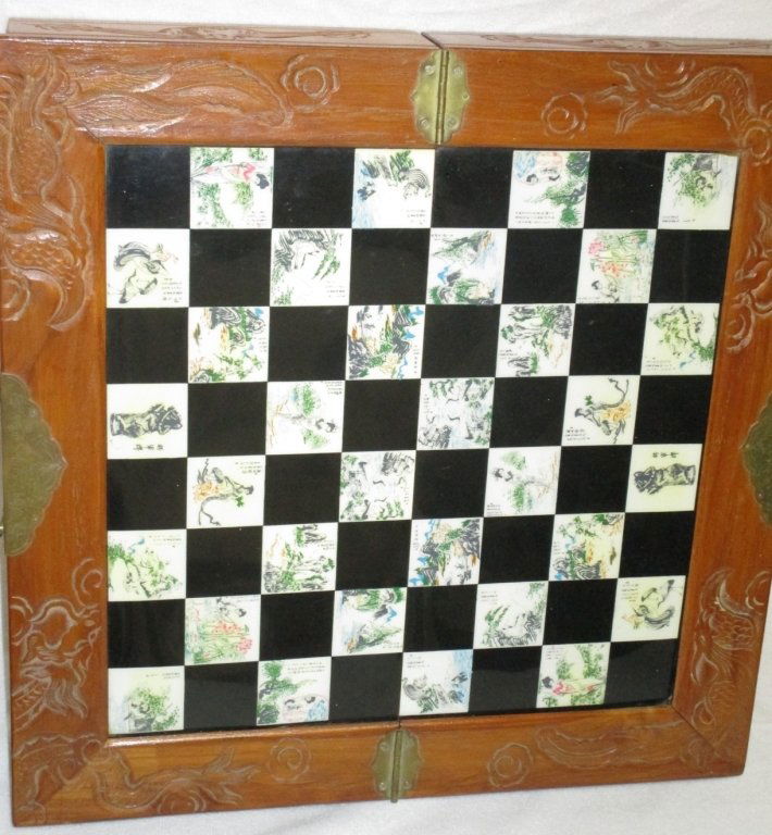 Korean Hand Carved Chess Set w/Handpainted Squares: Board w/drawers for chessmen, chop marks on painted squares which alternate on board w/ebony squares. Carved box 18" square open, brass hardware.