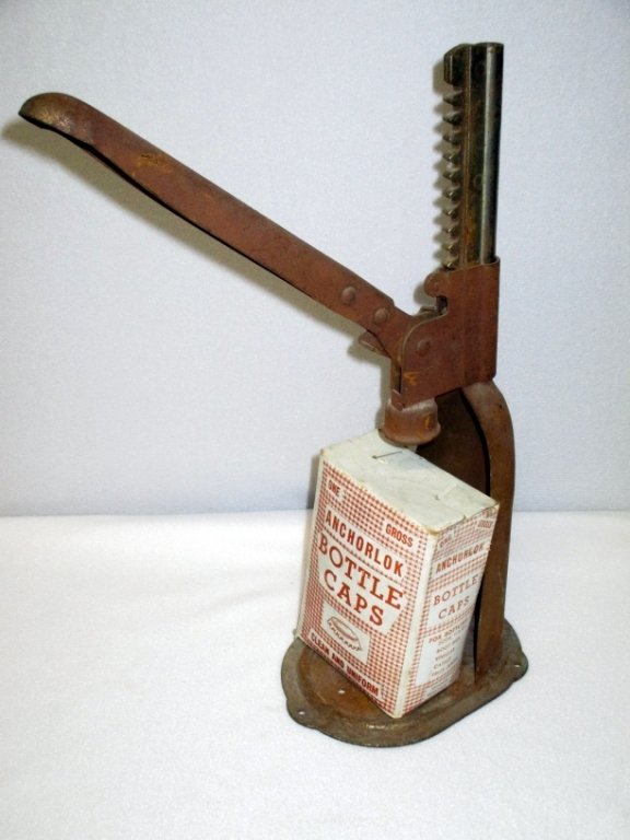 Vintage Bottle Capper w/Box of Caps: For bottling soda water, root beer, vinegar, catsup and fruit juices; caps are Anchorlok, Brooklyn, NY. Capper rusted.