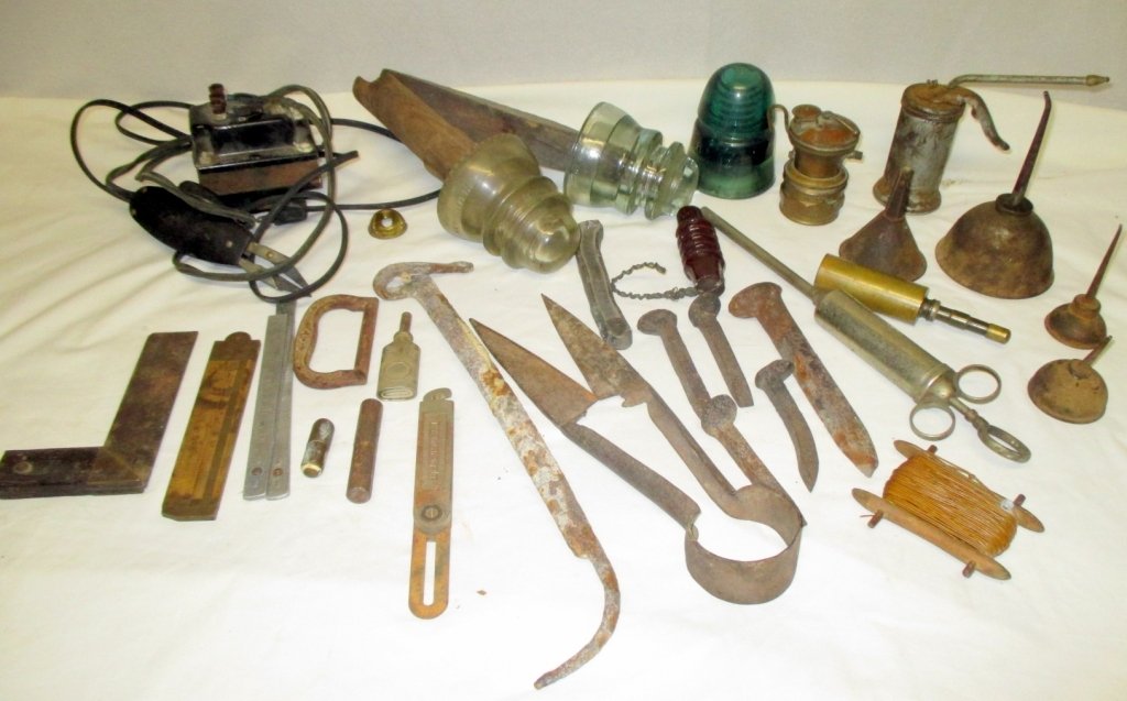 Insulators, Oil Cans, Brass Miner's Lamp Plus: Clear Hemingray 42 & Armstrong DP1 w/wood, green 8 & spiral ceramic insulators and various size oil cans, Universal Lamp Co. Auto-Lite, various size RR spikes, wired electric scissors, metal hand held