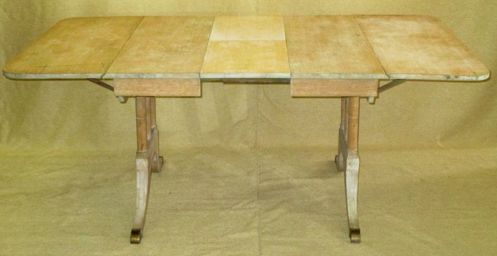 Dining Drop Leaf Table w/Folding Center Leaf: 3 column end supports, metal toe caps, 72" x 38" x 29.75"T (includes two drop leaves of 16" and the middle folding leaf which is 13"). Stripped for refinishing.