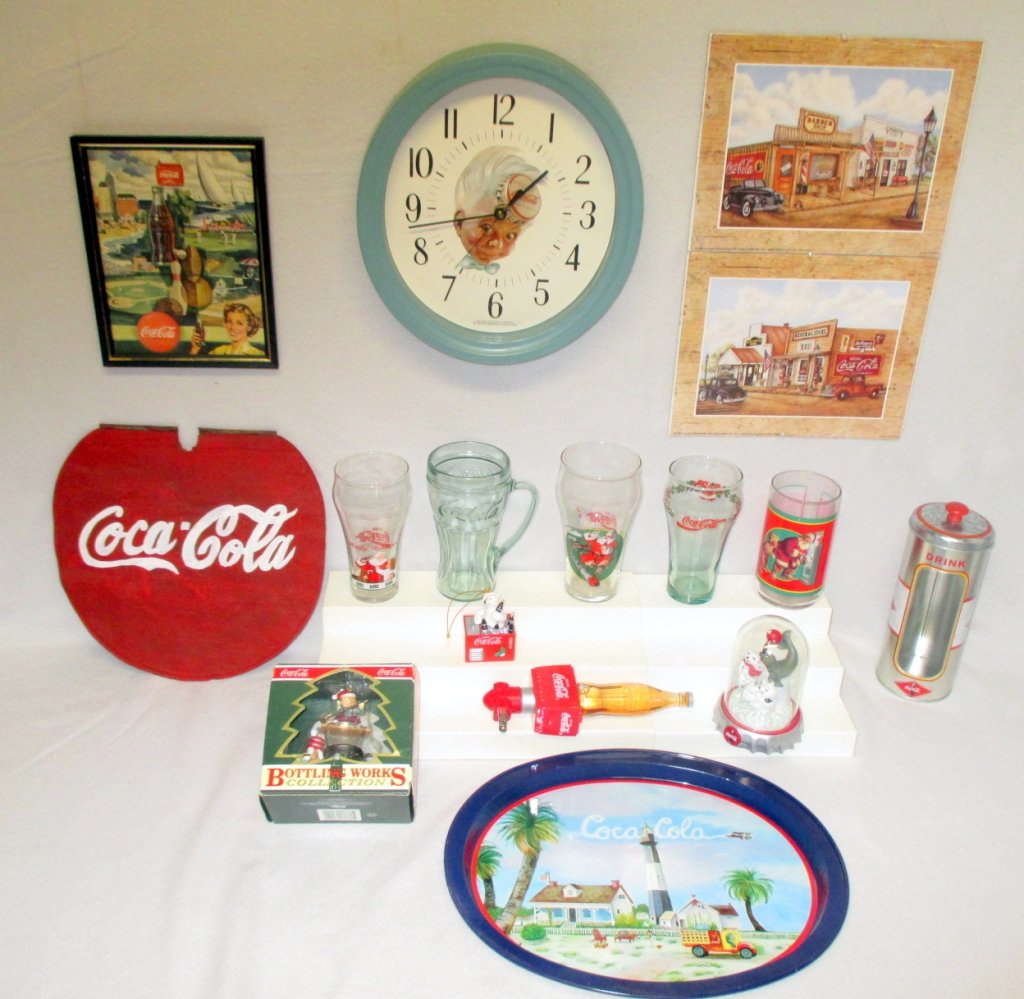 Coca Cola Collectibles: Clock, framed advertising w/1950s appearing ads on back, elf ornament in orig. package, tray painted metal sign, straw dispenser, bear/ice chest ornament, North Pole Playmate, prints, glasses & night
